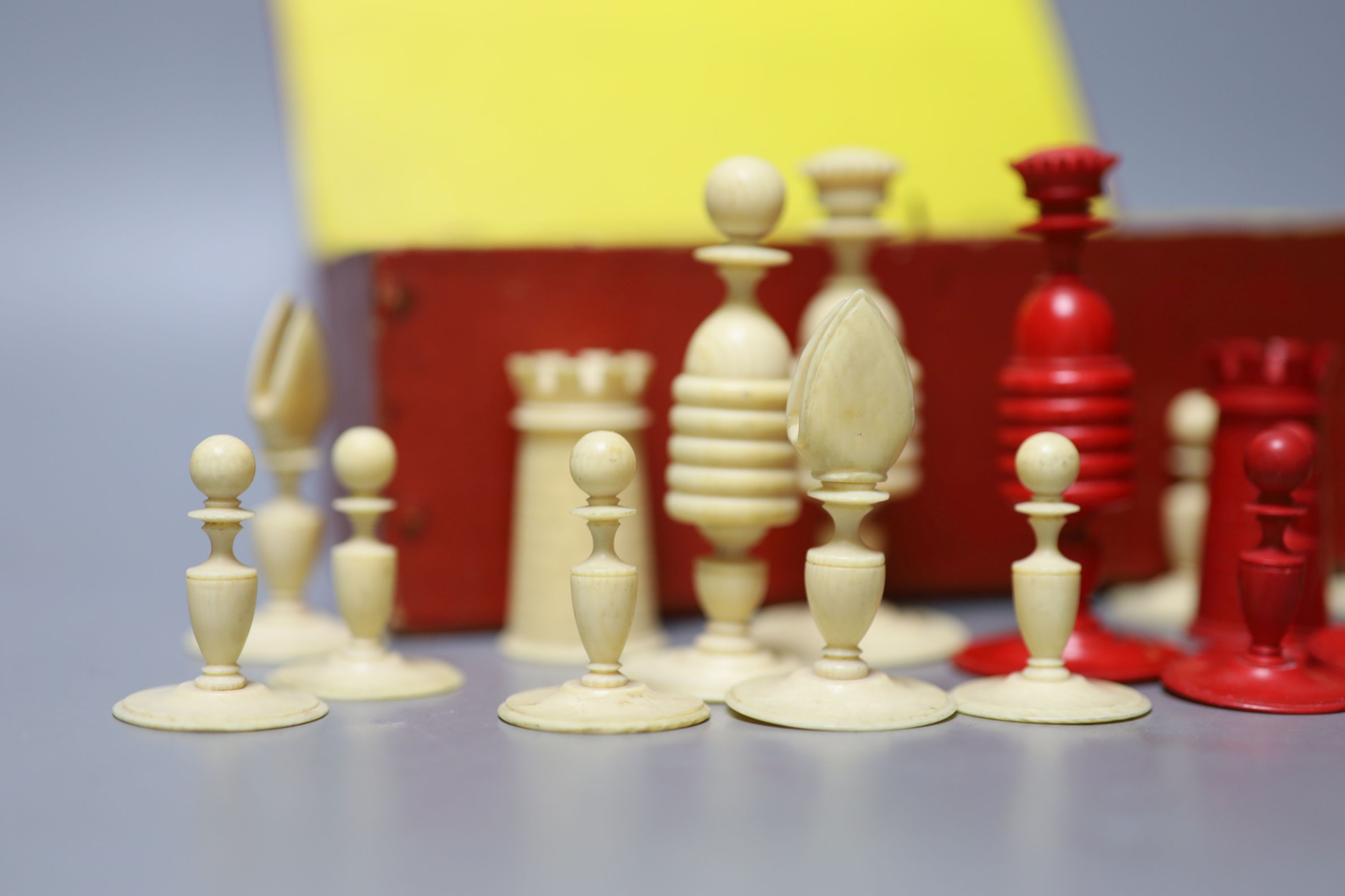 A 19th century red stained and natural ivory chess set, Kings 8.2 cm